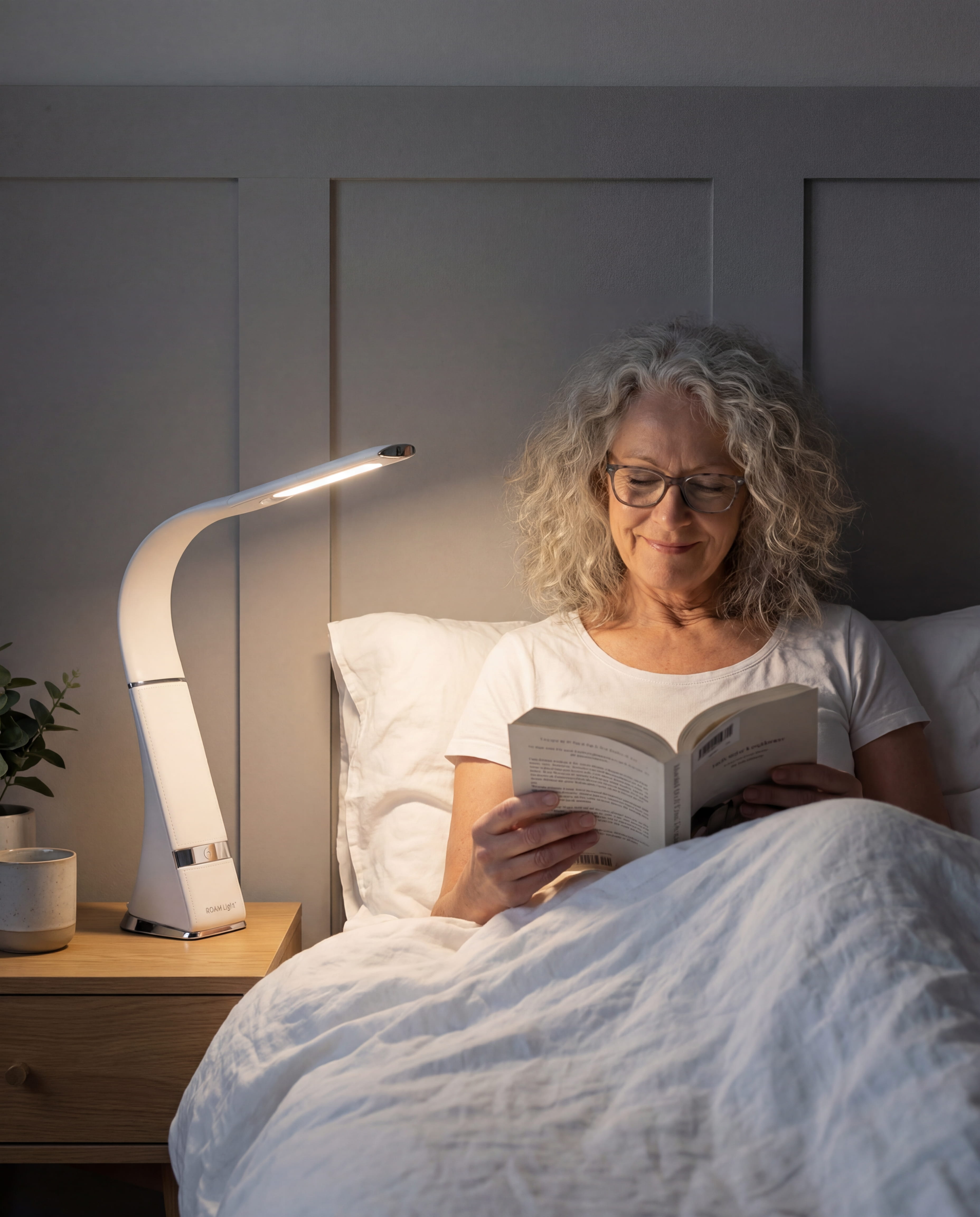 HD ROAM in Heritage White on a bedside table