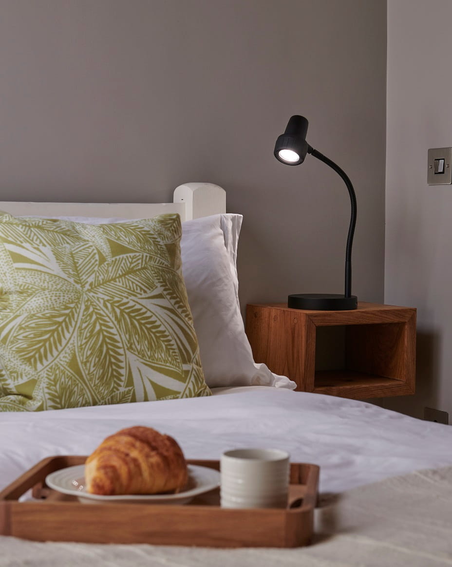 The HD Mini, a compact cordless reading light with a flexible arm