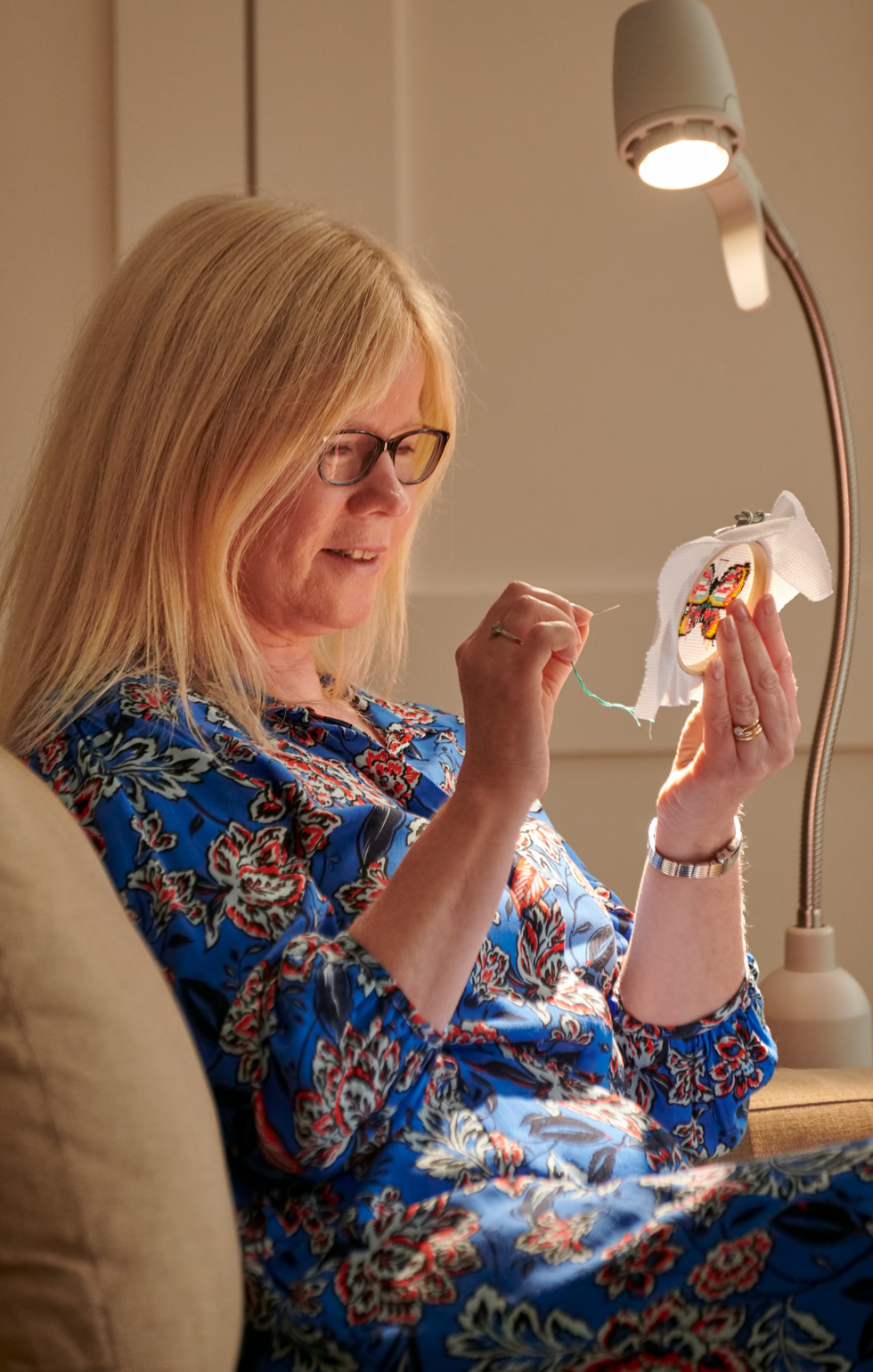 Helen at her needlework, the work lit by her Serious Readers light